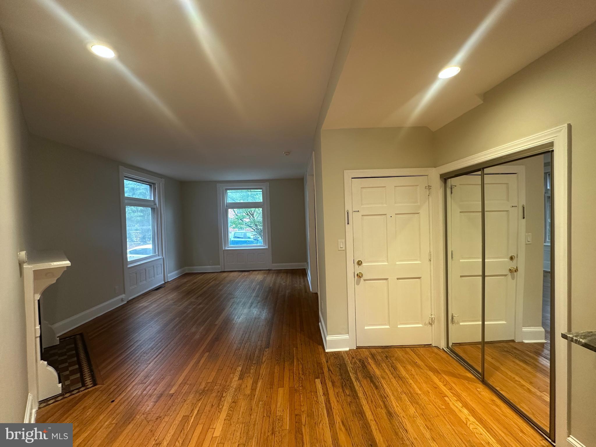 1306 West 13th Street, Unit 1 Wilmington, DE 19806 - Photo 11 of 21 wooden floor in an empty room with a window