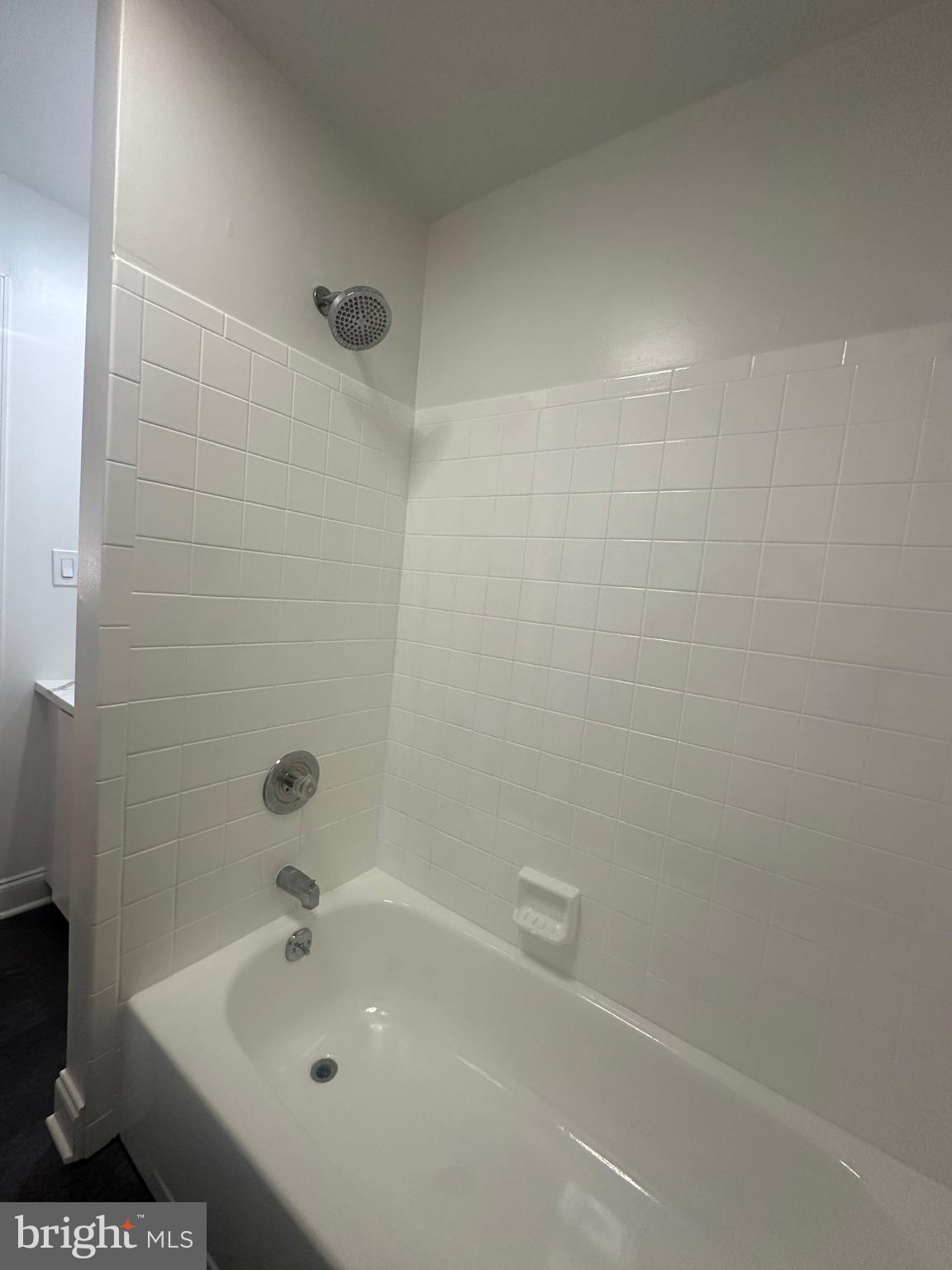 1306 West 13th Street, Unit 1 Wilmington, DE 19806 - Photo 14 of 21 a bathroom with a sink and a mirror