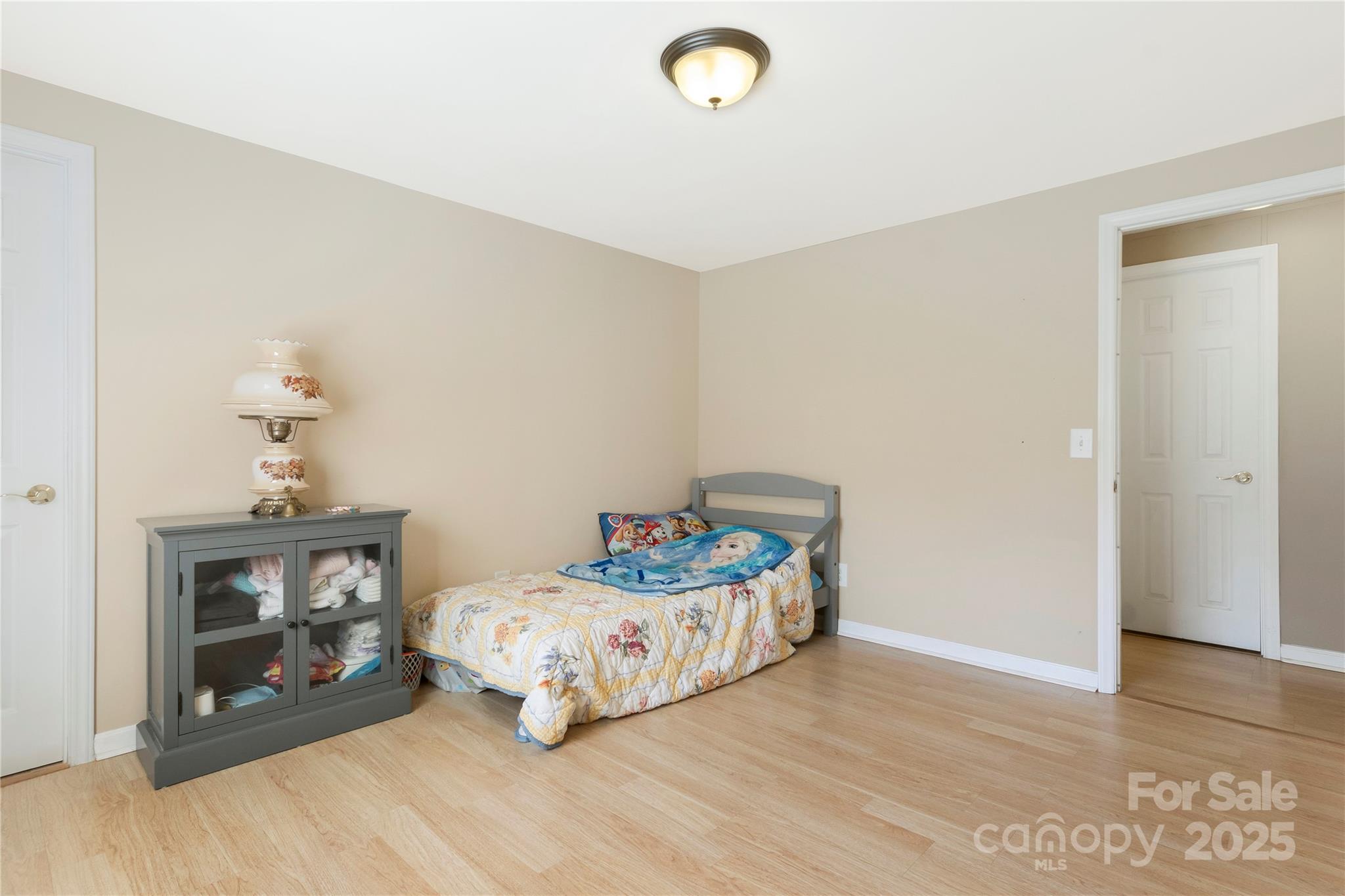 3080 Sims Road Rock Hill, SC 29730 - Photo 20 of 25 a bedroom with a bed and wooden floor