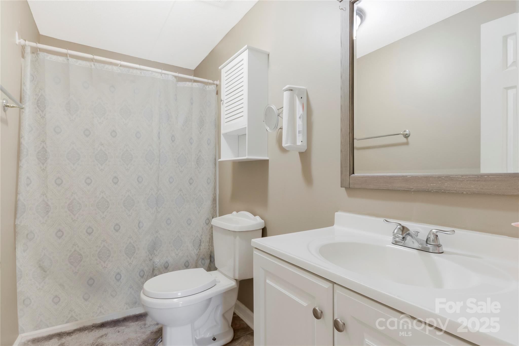 3080 Sims Road Rock Hill, SC 29730 - Photo 21 of 25 a bathroom with a sink a toilet and a mirror