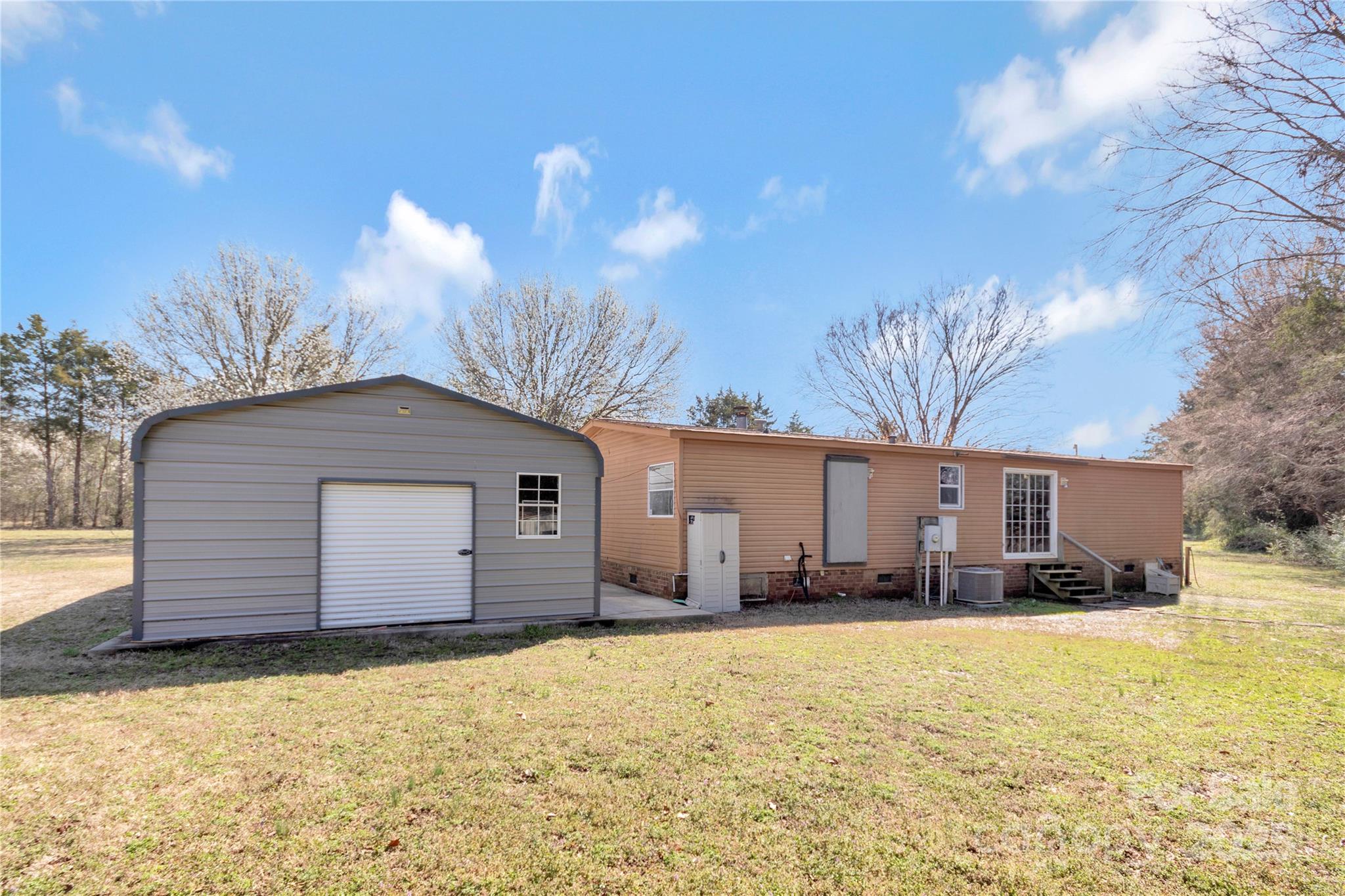 3080 Sims Road Rock Hill, SC 29730 - Photo 25 of 25 a front view of house with yard and trees in the background