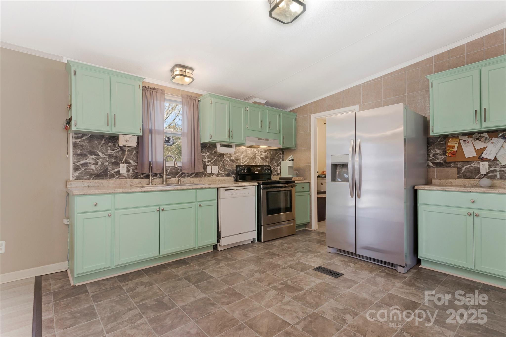 3080 Sims Road Rock Hill, SC 29730 - Photo 6 of 25 a kitchen with a refrigerator sink and cabinets