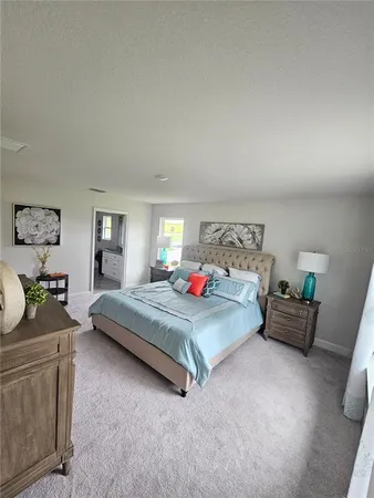 a bedroom with bed and window