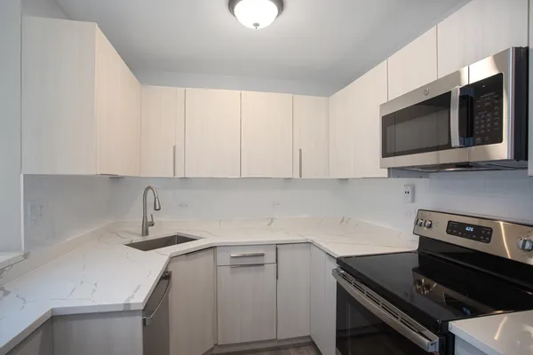 a kitchen with a stove and a microwave