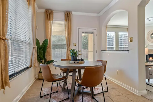 a kitchen with granite countertop a stove sink and cabinets