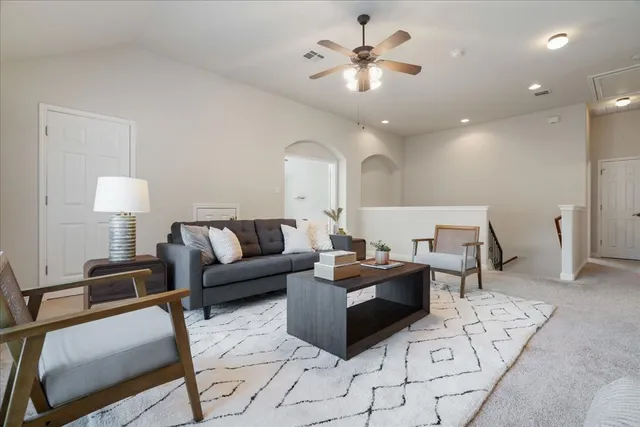 a bathroom with a granite countertop sink a toilet and with mirror