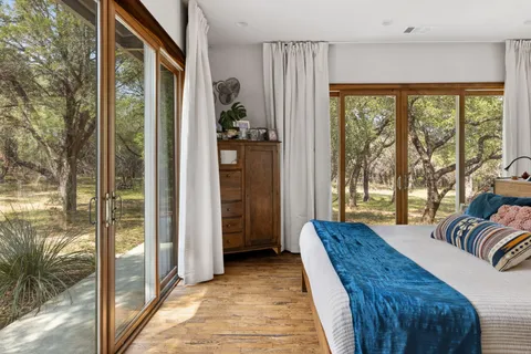 a view of a hallway with paintings on the wall
