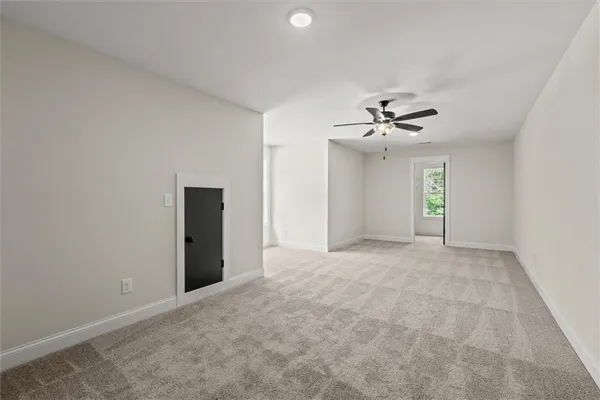 a bathroom with a granite countertop sink a toilet and bathtub