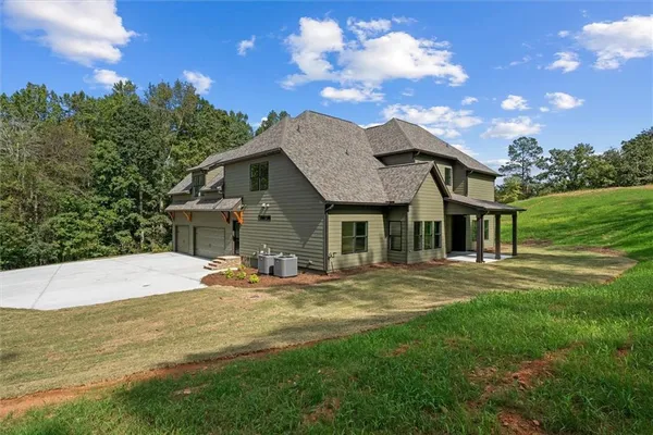 a house with trees in the background