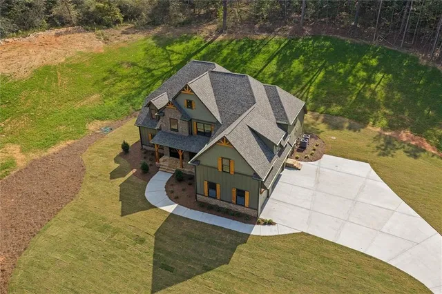 a aerial view of a house with a yard