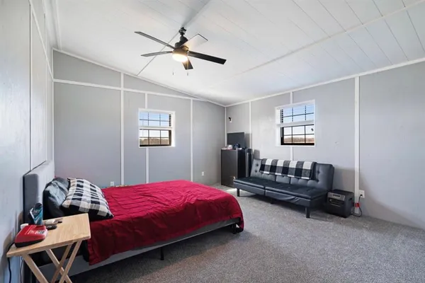 a bedroom with a bed and a shower