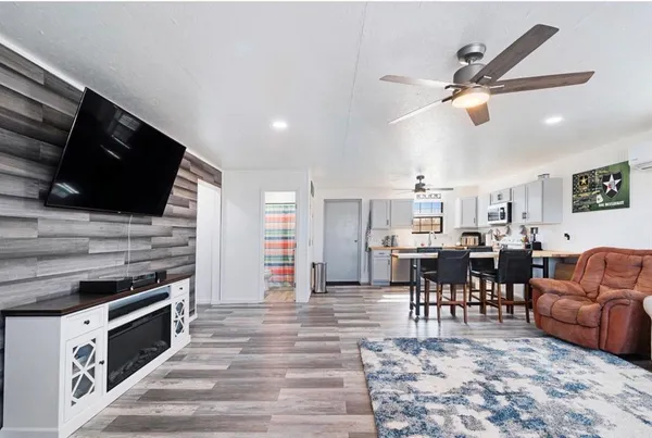 a view of kitchen with cabinets table and chairs