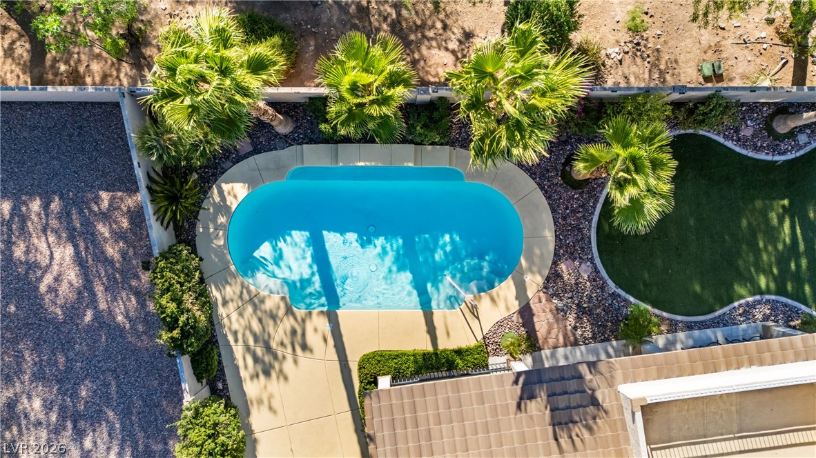 708 Vortex Avenue Henderson, NV 89002 - Photo 67 of 71 Lush landscaping surrounds this private, inviting in-ground pool.