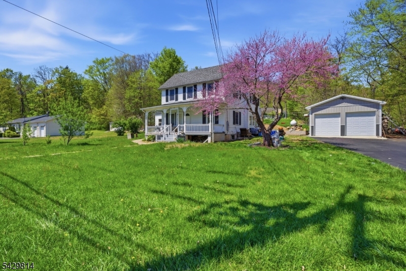 251 Russia Road Oak Ridge, NJ 07438 - Photo 1 of 34 a front view of a house with garden