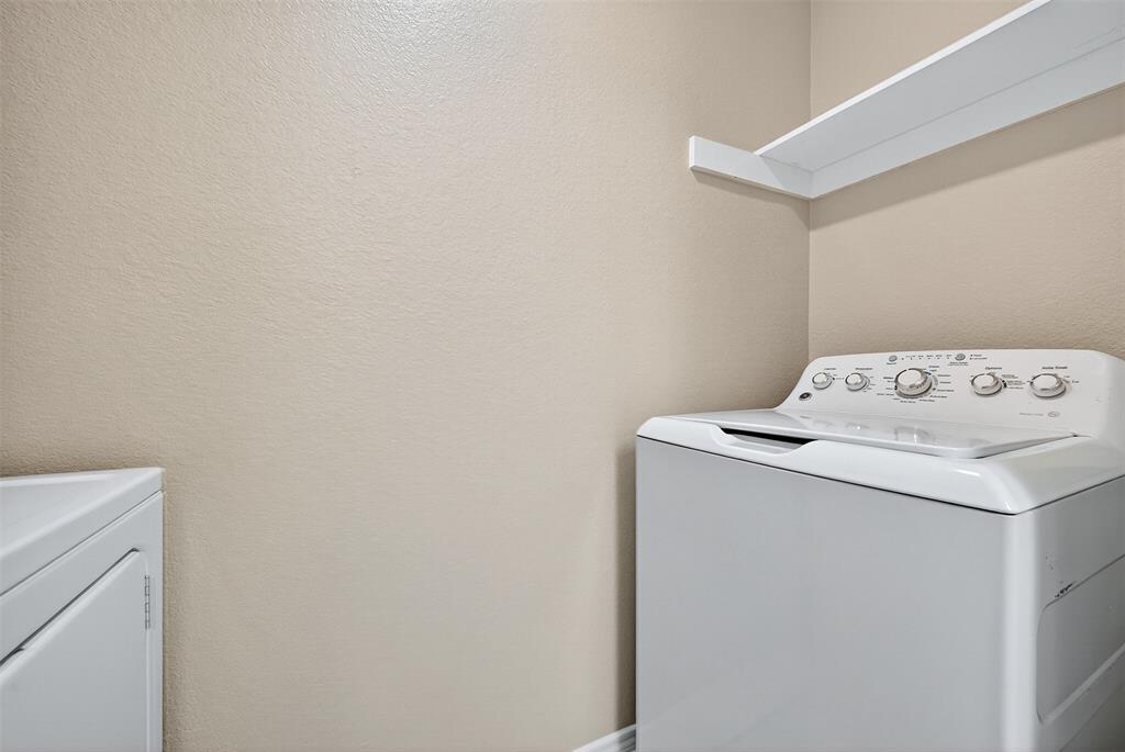 1813 Park Place Sherman, TX 75092 - Photo 12 of 23 a utility room with dryer and washer