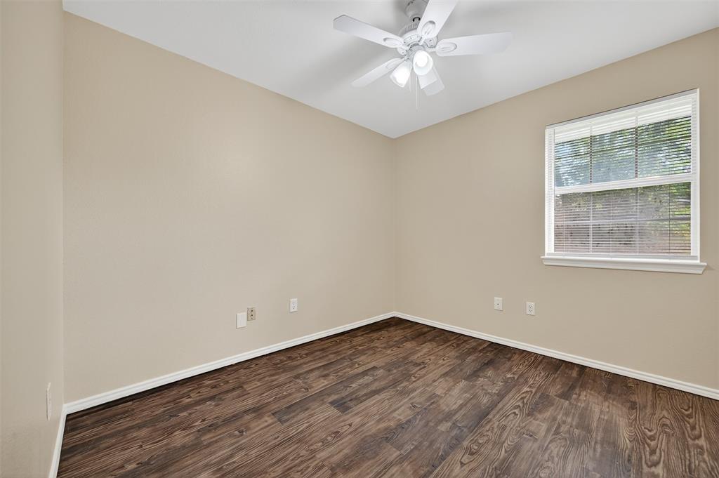 1813 Park Place Sherman, TX 75092 - Photo 19 of 23 a view of a big room with wooden floor and windows in a room