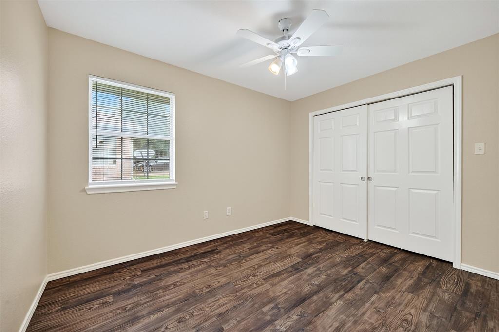 1813 Park Place Sherman, TX 75092 - Photo 20 of 23 a view of an empty room with wooden floor and a window