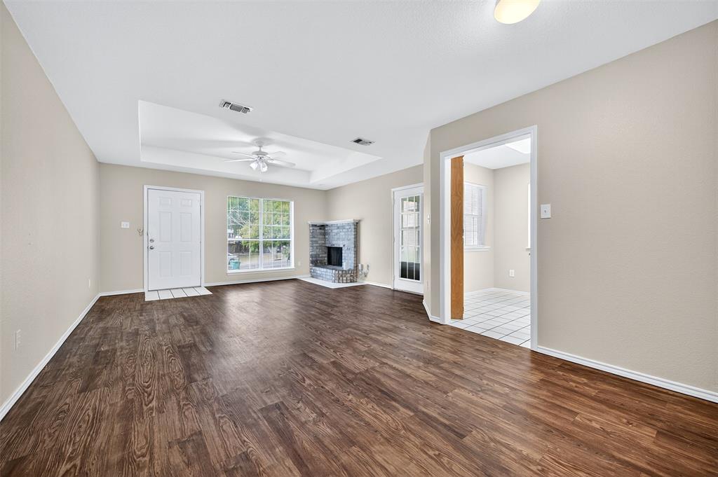 1813 Park Place Sherman, TX 75092 - Photo 5 of 23 a view of empty room with wooden floor and fan