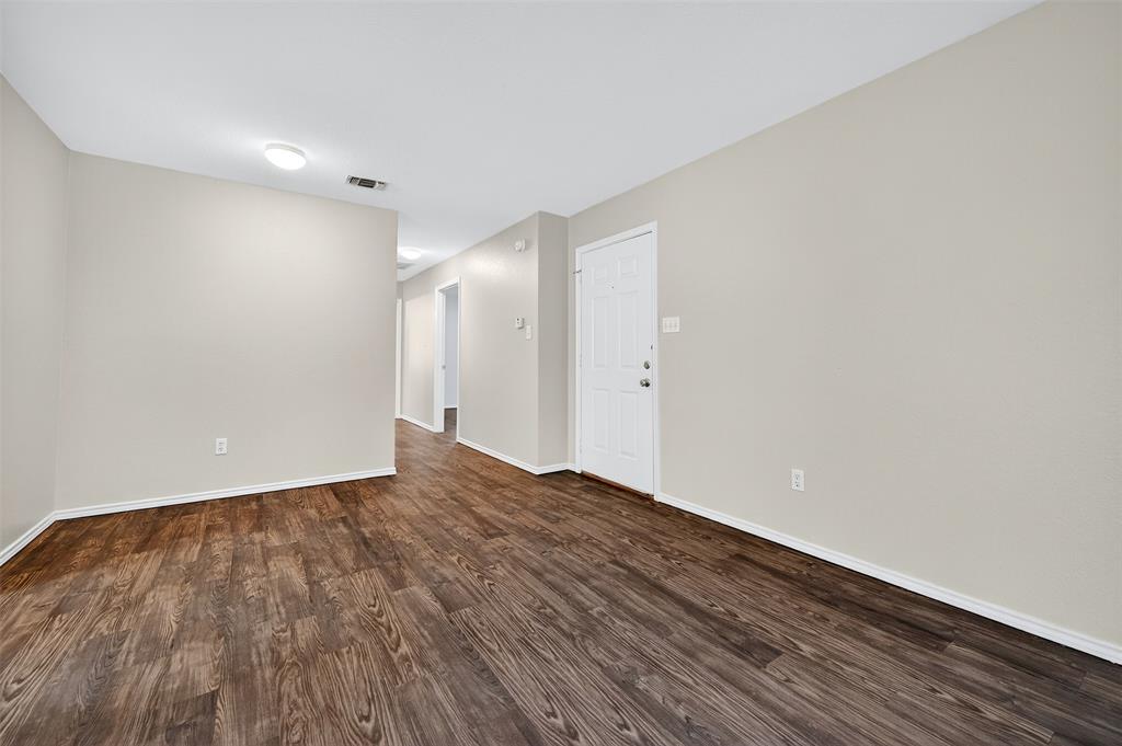 1813 Park Place Sherman, TX 75092 - Photo 7 of 23 a view of an empty room with wooden floor