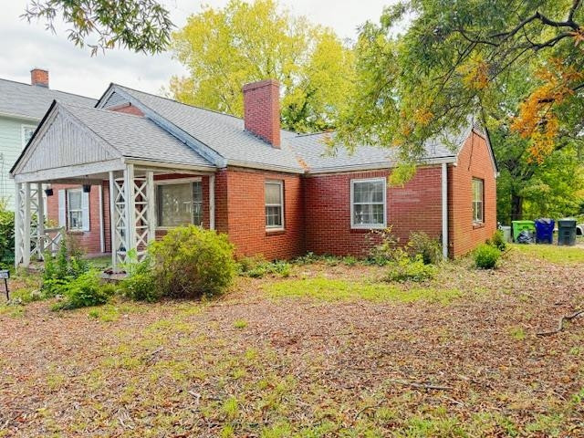 a front view of house with small garden