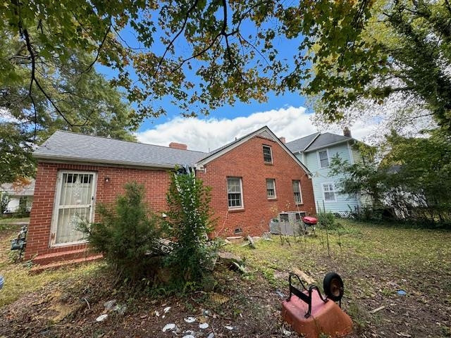 1304 East Jones Street Raleigh, NC 27610 - Photo 3 of 13 a front view of a house with a yard