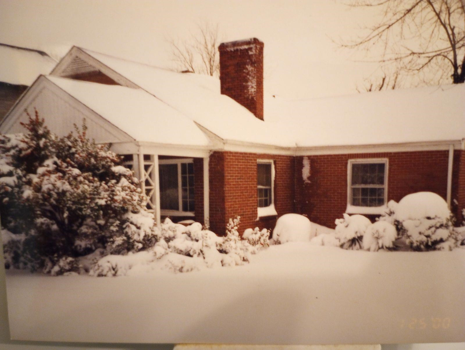 1304 East Jones Street Raleigh, NC 27610 - Photo 6 of 13 a view of a house with snow in the yard
