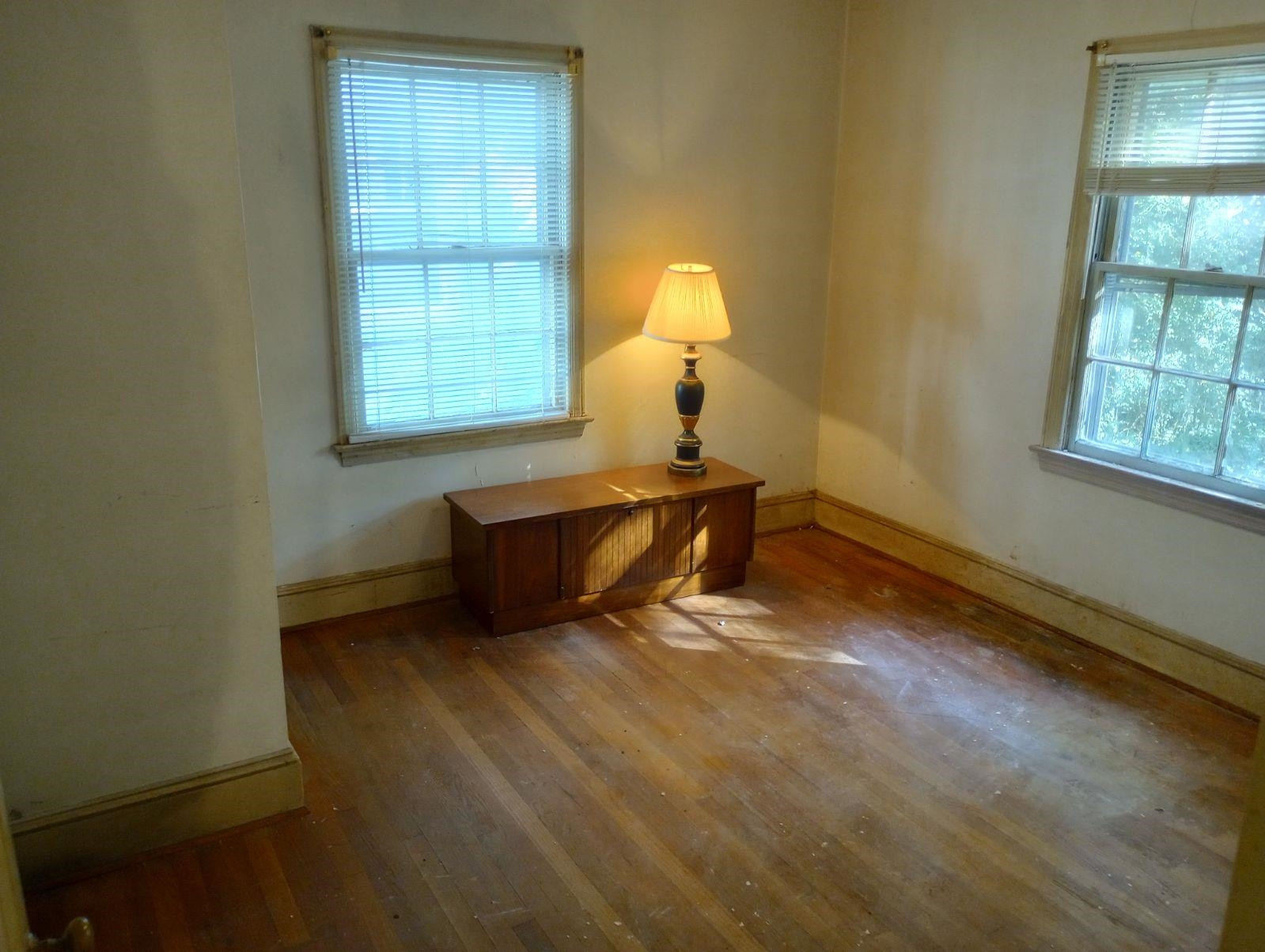 1304 East Jones Street Raleigh, NC 27610 - Photo 10 of 13 a bed room with a bed and a window