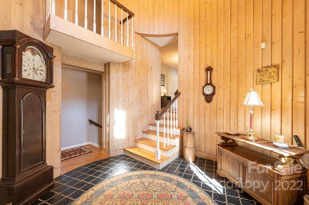 1761 4th St Circle Northeast Hickory, NC 28601 - Photo 12 of 48 a view of a hallway with entryway wooden floor and front door