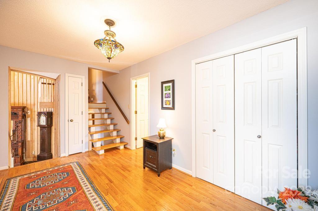 1761 4th St Circle Northeast Hickory, NC 28601 - Photo 15 of 48 a bedroom with a bed and a chandelier