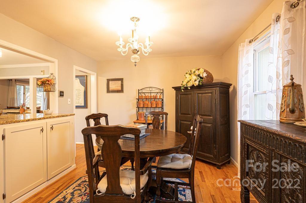 1761 4th St Circle Northeast Hickory, NC 28601 - Photo 20 of 48 a view of a dining room with furniture and chandelier