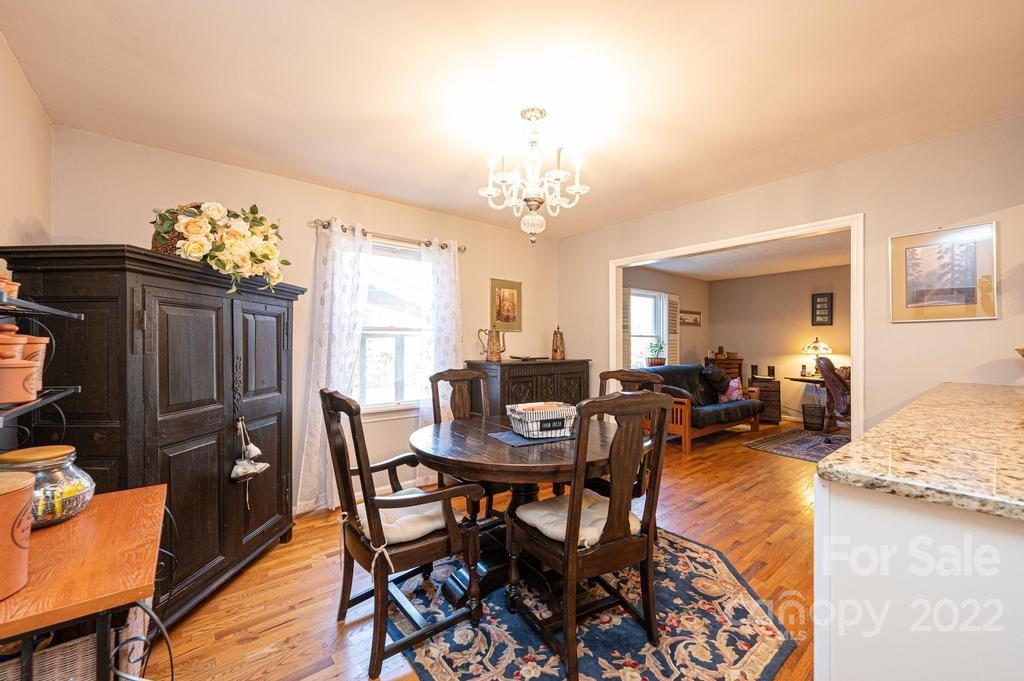 1761 4th St Circle Northeast Hickory, NC 28601 - Photo 22 of 48 a view of a dining room with furniture and chandelier