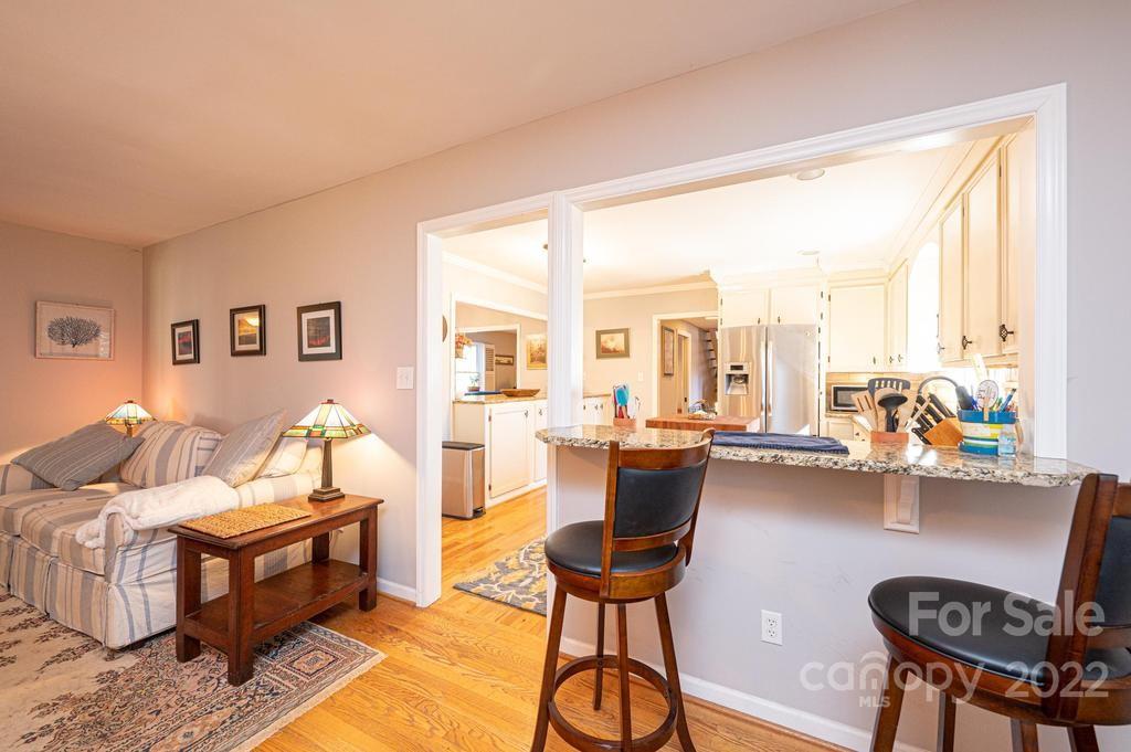 1761 4th St Circle Northeast Hickory, NC 28601 - Photo 27 of 48 a living room with furniture and a large window