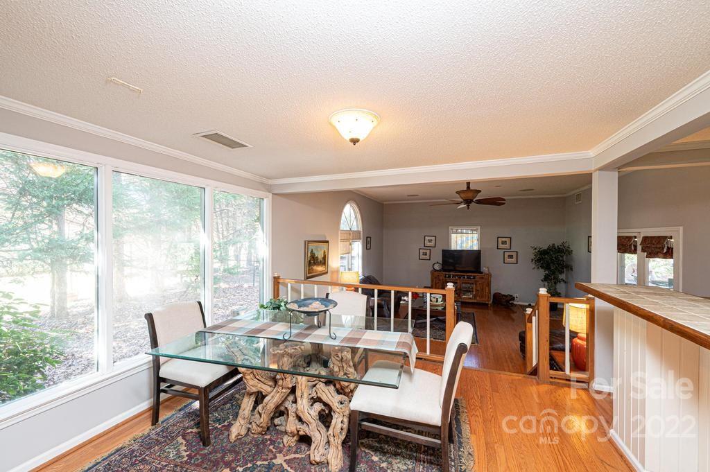 1761 4th St Circle Northeast Hickory, NC 28601 - Photo 32 of 48 a dining room with furniture a rug and a large window