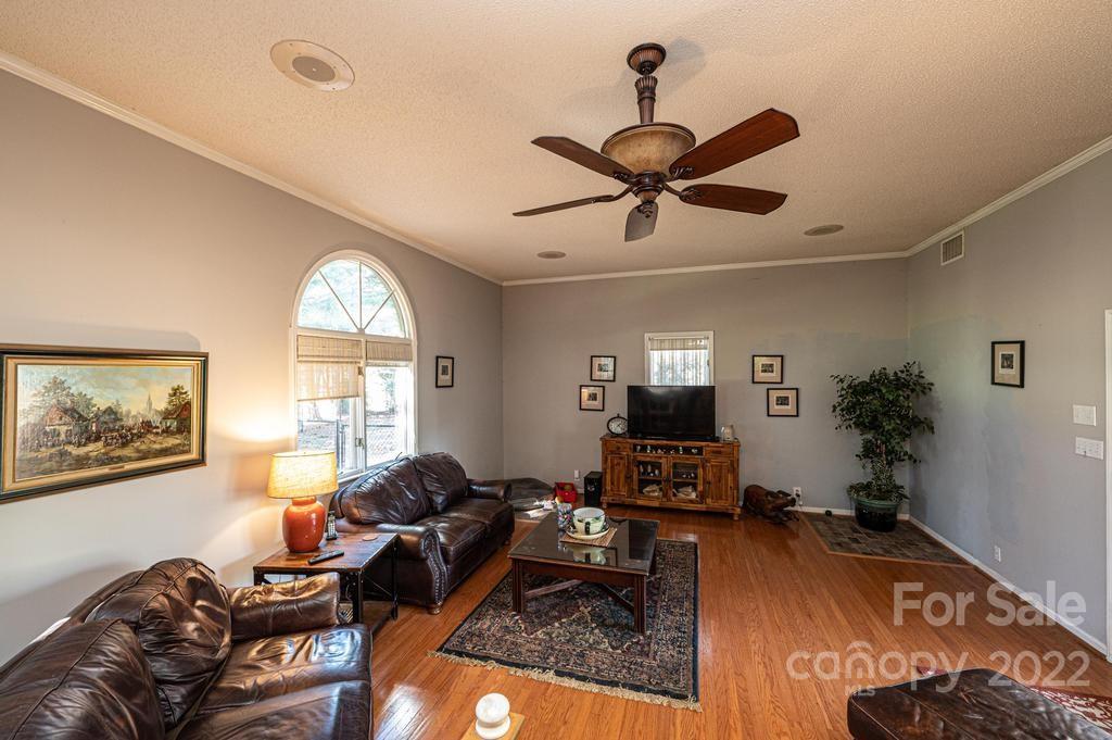 1761 4th St Circle Northeast Hickory, NC 28601 - Photo 35 of 48 a living room with furniture a window and a flat screen tv