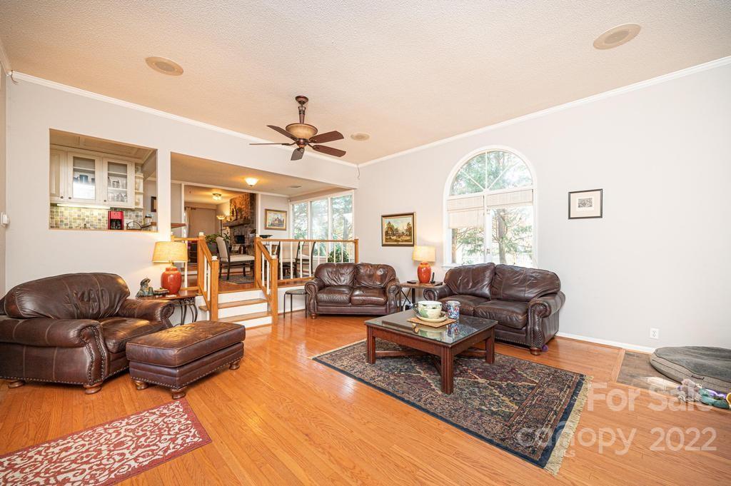 1761 4th St Circle Northeast Hickory, NC 28601 - Photo 37 of 48 a living room with furniture a rug and a large window