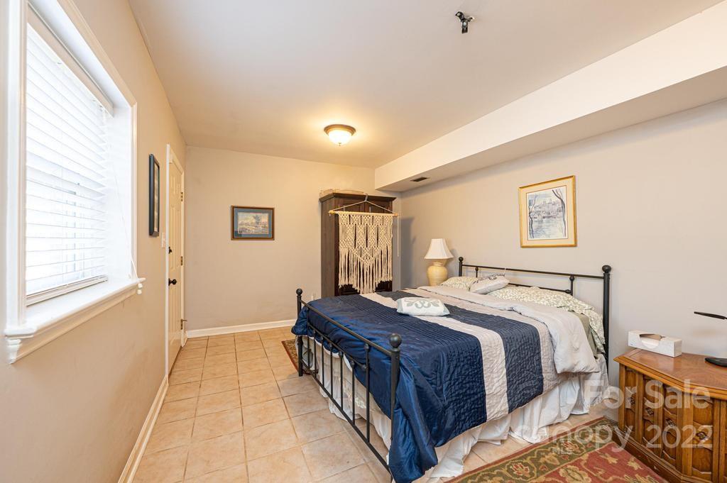 1761 4th St Circle Northeast Hickory, NC 28601 - Photo 39 of 48 a bedroom with a bed and a large window