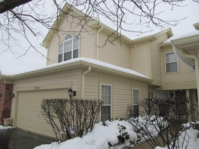 36166 North Edgewater Court Gurnee, IL 60031 - Photo 1 of 12 a front view of a house with a yard