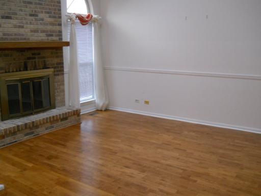 36166 North Edgewater Court Gurnee, IL 60031 - Photo 2 of 12 an empty room with wooden floor and windows