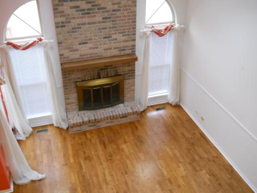 36166 North Edgewater Court Gurnee, IL 60031 - Photo 4 of 12 a view of empty room with wooden floor and fan