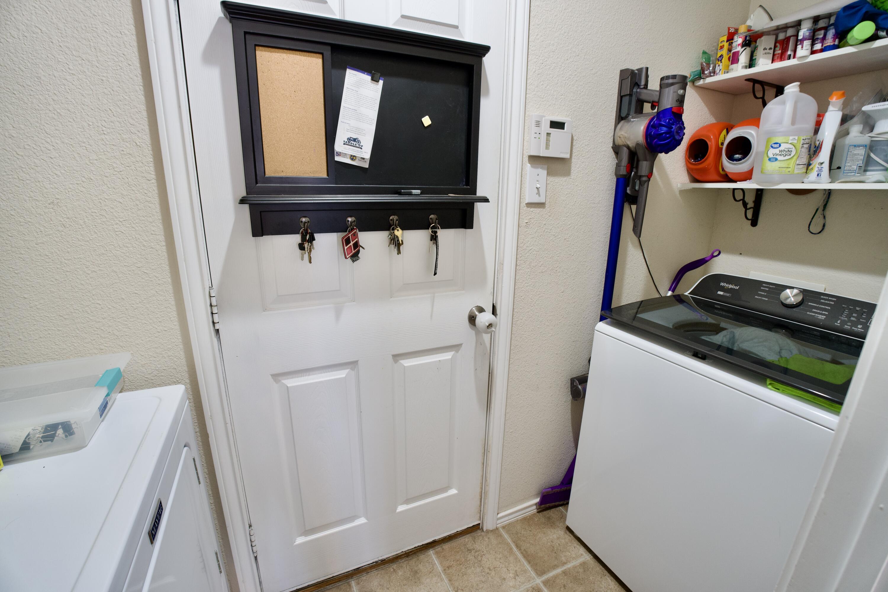 8811 16th Street Lubbock, TX 79416 - Photo 15 of 17 a room with storage and utility