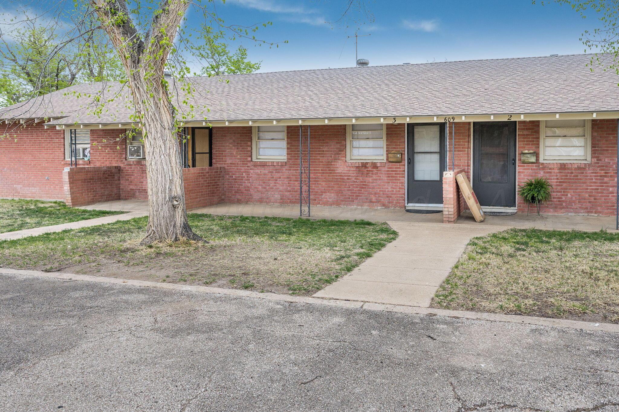 609 16th Street, Unit 3 Canyon, TX 79015 - Photo 1 of 15 a front view of a house with garden
