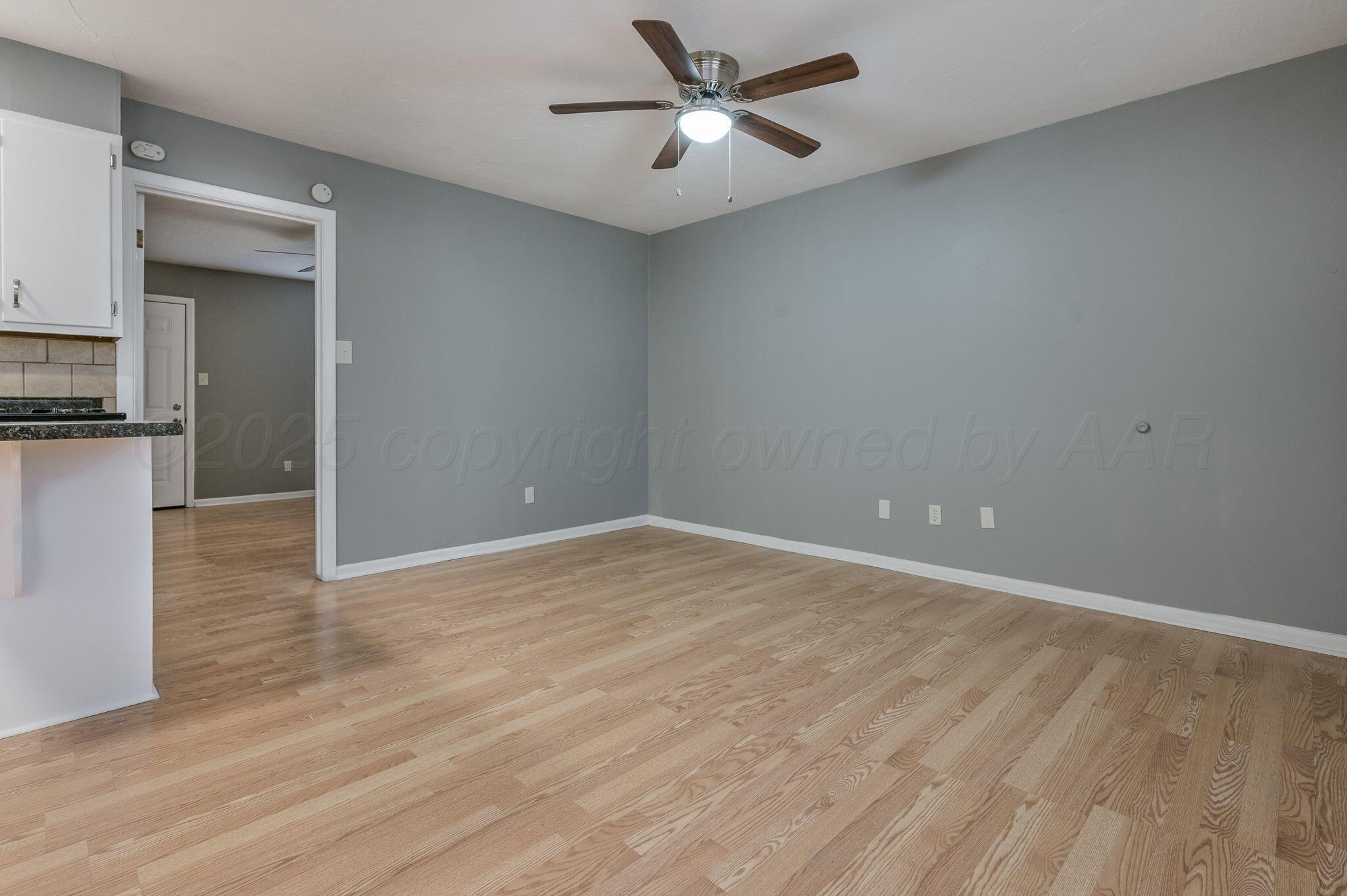 609 16th Street, Unit 3 Canyon, TX 79015 - Photo 4 of 15 a view of a kitchen with a dishwasher and a refrigerator