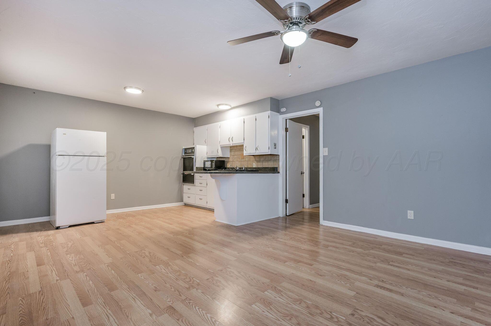 609 16th Street, Unit 3 Canyon, TX 79015 - Photo 5 of 15 a view of a kitchen with a sink and a window