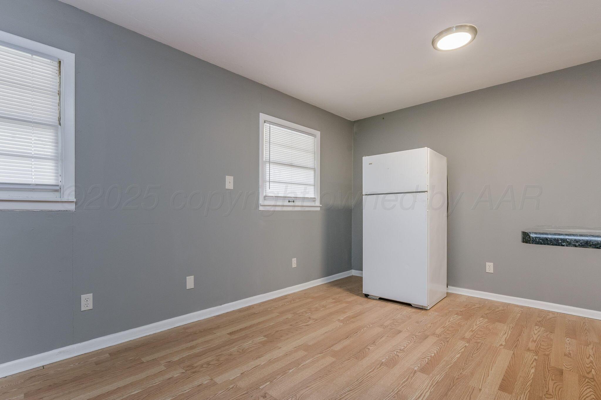 609 16th Street, Unit 3 Canyon, TX 79015 - Photo 9 of 15 an empty room with windows and closet