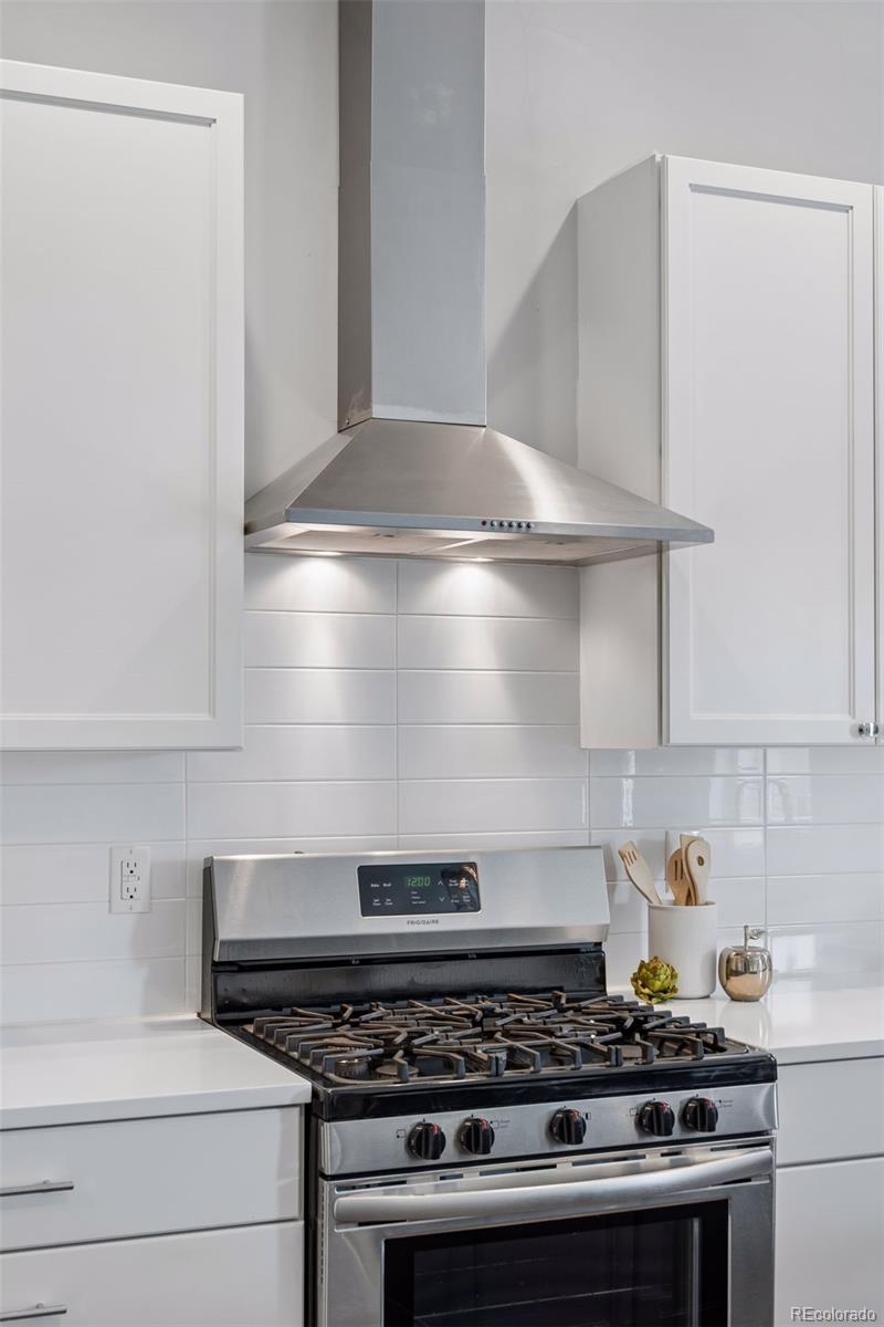 1235 Perry Street Denver, CO 80204 - Photo 11 of 41 a stove top oven sitting inside of a kitchen
