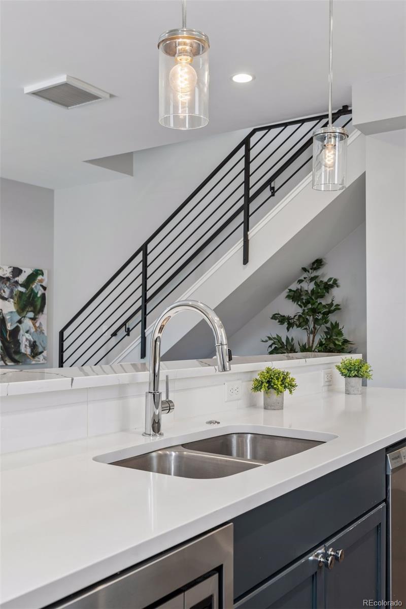1235 Perry Street Denver, CO 80204 - Photo 12 of 41 a kitchen with a sink and cabinets