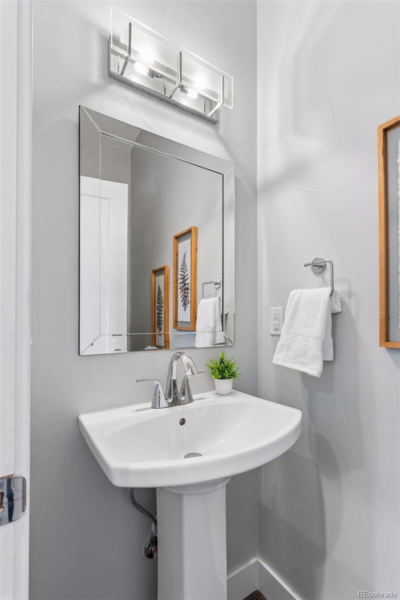 1235 Perry Street Denver, CO 80204 - Photo 14 of 41 a bathroom with a sink and a mirror