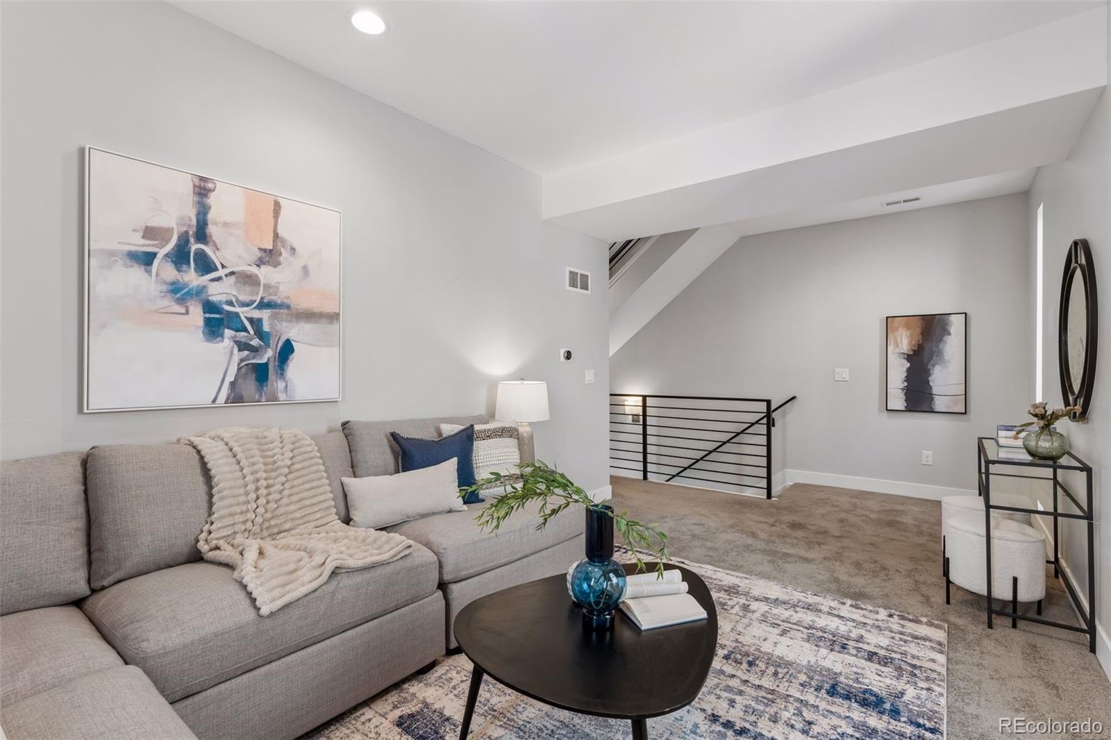 1235 Perry Street Denver, CO 80204 - Photo 17 of 41 a living room with furniture and a potted plant