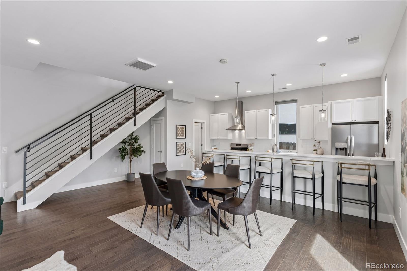 1235 Perry Street Denver, CO 80204 - Photo 4 of 41 a view of kitchen dining table and chairs