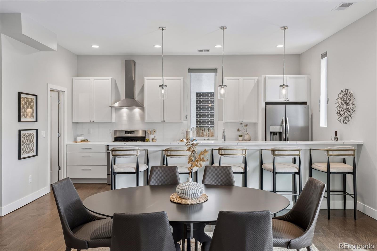 1235 Perry Street Denver, CO 80204 - Photo 5 of 41 a large kitchen with a table and chairs